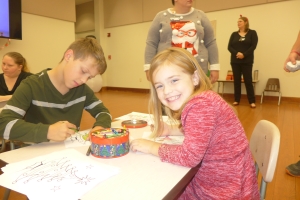 From left, Braydin and Caitlynn Mizell enjoy coloring activities during the event. Braydin spent five days in the NICU when he was born prematurely.